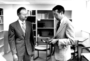 Ralph Havener receives service award from Mel George, 1984
