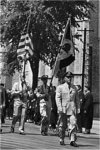 Graduates, Led by Color Guard, in front of Memorial Union