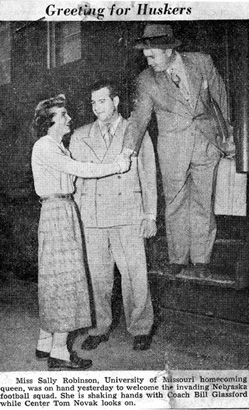 MU homecoming queen, Sally Robinson, Greets University of Nebraska Players and Coach, 1949