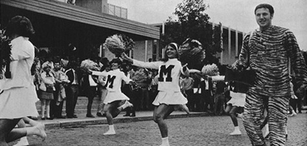 Mascot marching with cheerleaders, 1970