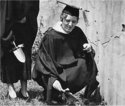 A Female Graduate Uses a Small Shovel to Plant Ivy