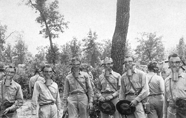 Military trainees wearing gas masks